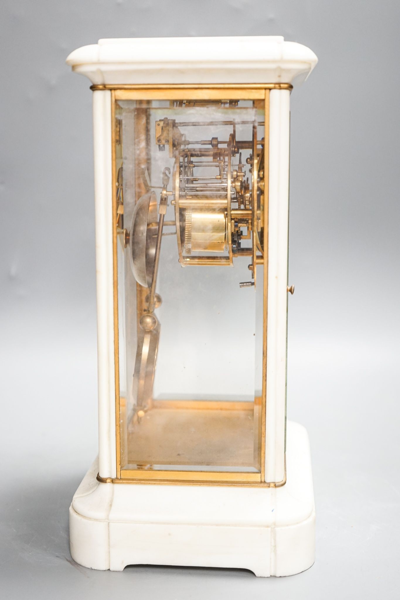 An unusual French white marble and brass cased four glass mantel clock, late 19th century, bi-metallic pendulum, no key. 32cm